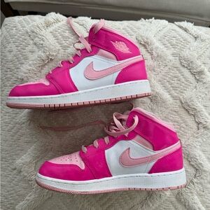 Air Jordan pink mid child 5.5. Worn less than 5 times like new condition.